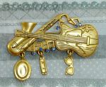 Брошь "Джаз бэнд" под античное золото/стразы