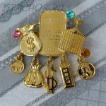 Брошь "Символы богатства и процветания" под золото/стразы