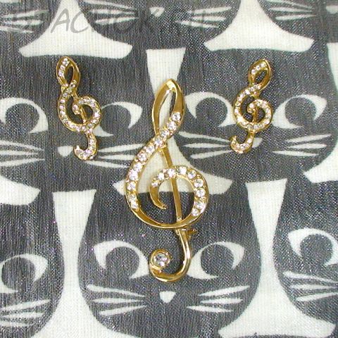 Брошь и серьги-гвоздики "Скрипичный ключ" под золото, стразы