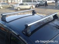 Багажник на крышу Renault Logan, Атлант, аэродинамические дуги, опора Е