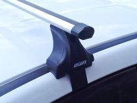 Багажник на крышу Nissan Juke, Атлант, аэродинамические дуги Эконом, опора Е